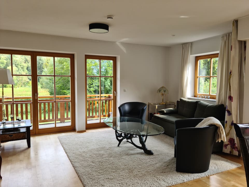 Bright living room overlooking greenery